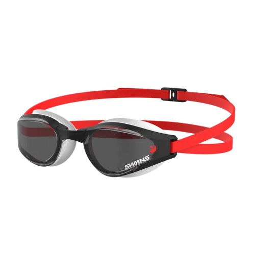 A pair of Ascender open water goggles with polarized/smoke lenses, featuring a red and black silicone strap.