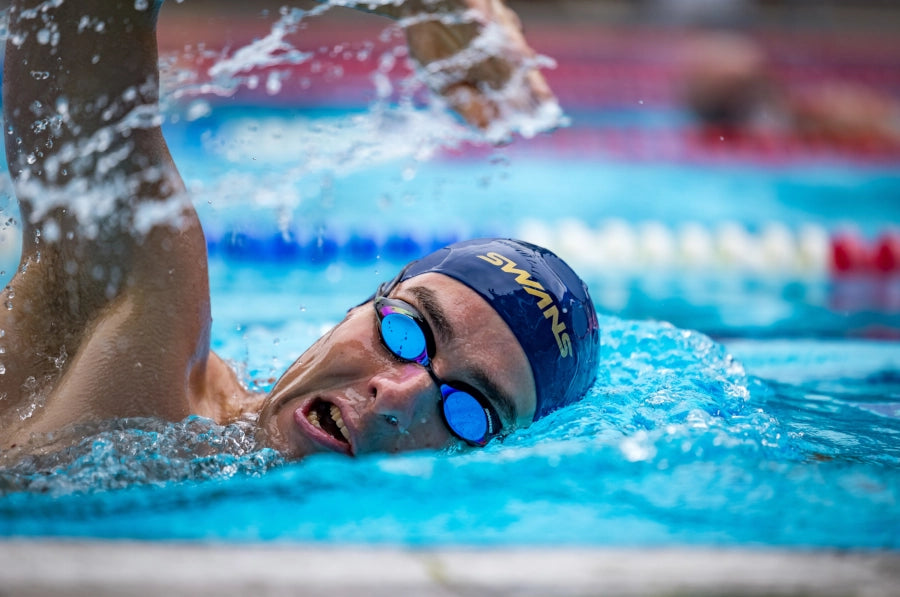 SWANS SRX swimming goggles with a navy blue and orange mirror lenses, orange nose piece and blue strap